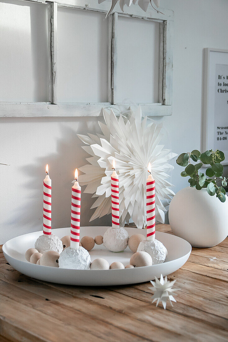 DIY Advent wreath made from baubles and striped candles