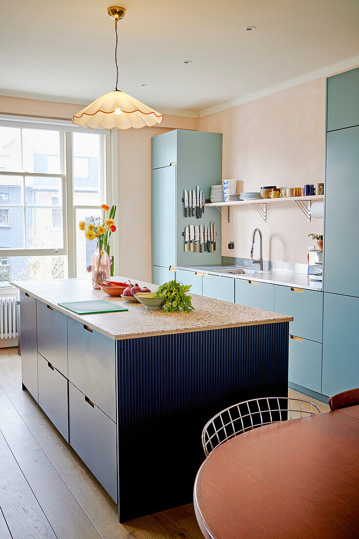 Modern kitchen with blue cabinets and central kitchen island