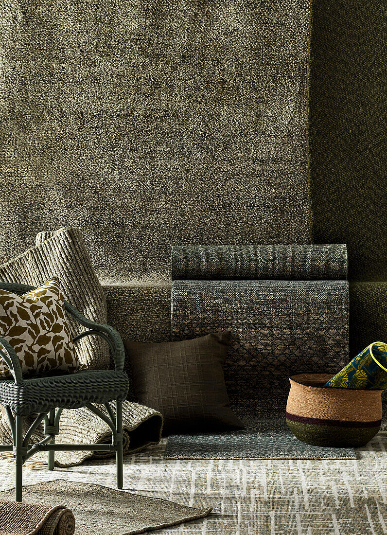 Textile collection in shades of brown with rattan chair and cushions