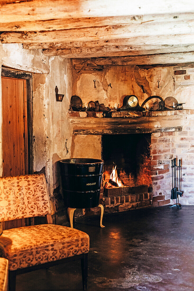 Cosy corner with fireplace in rustic living room