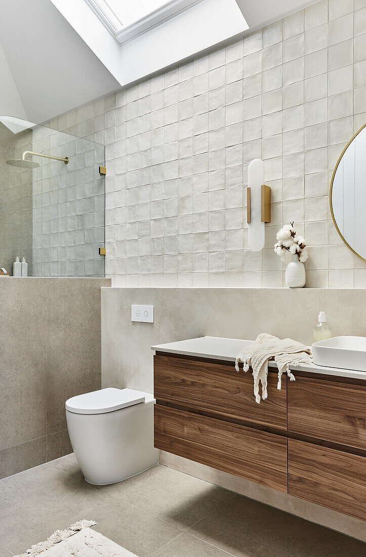 Bathroom with wooden washbasin and modern wall tiles