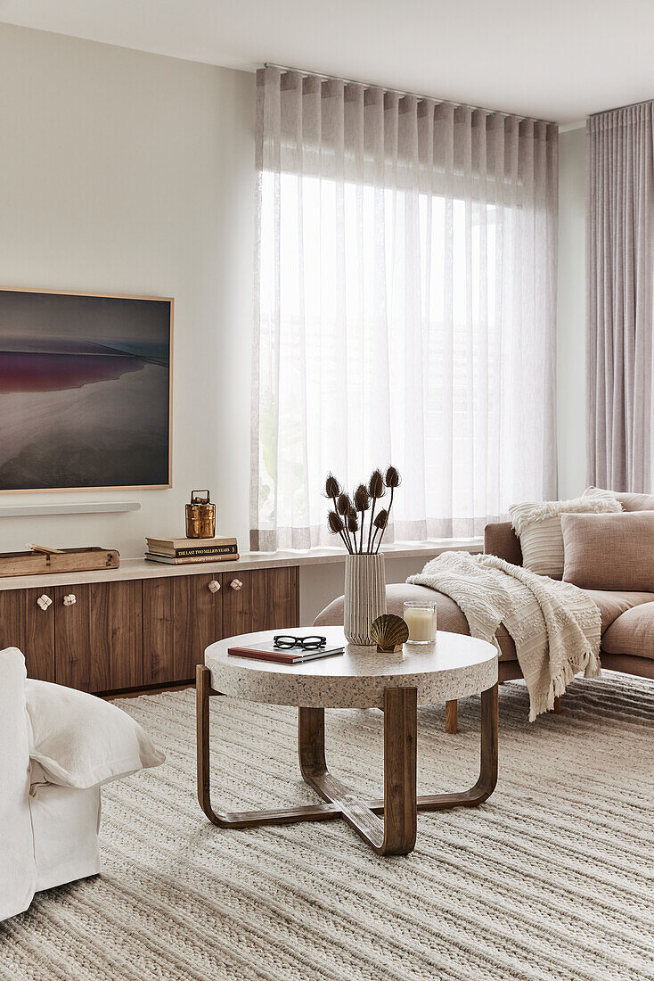 Living room with modern side table, sideboard and TV