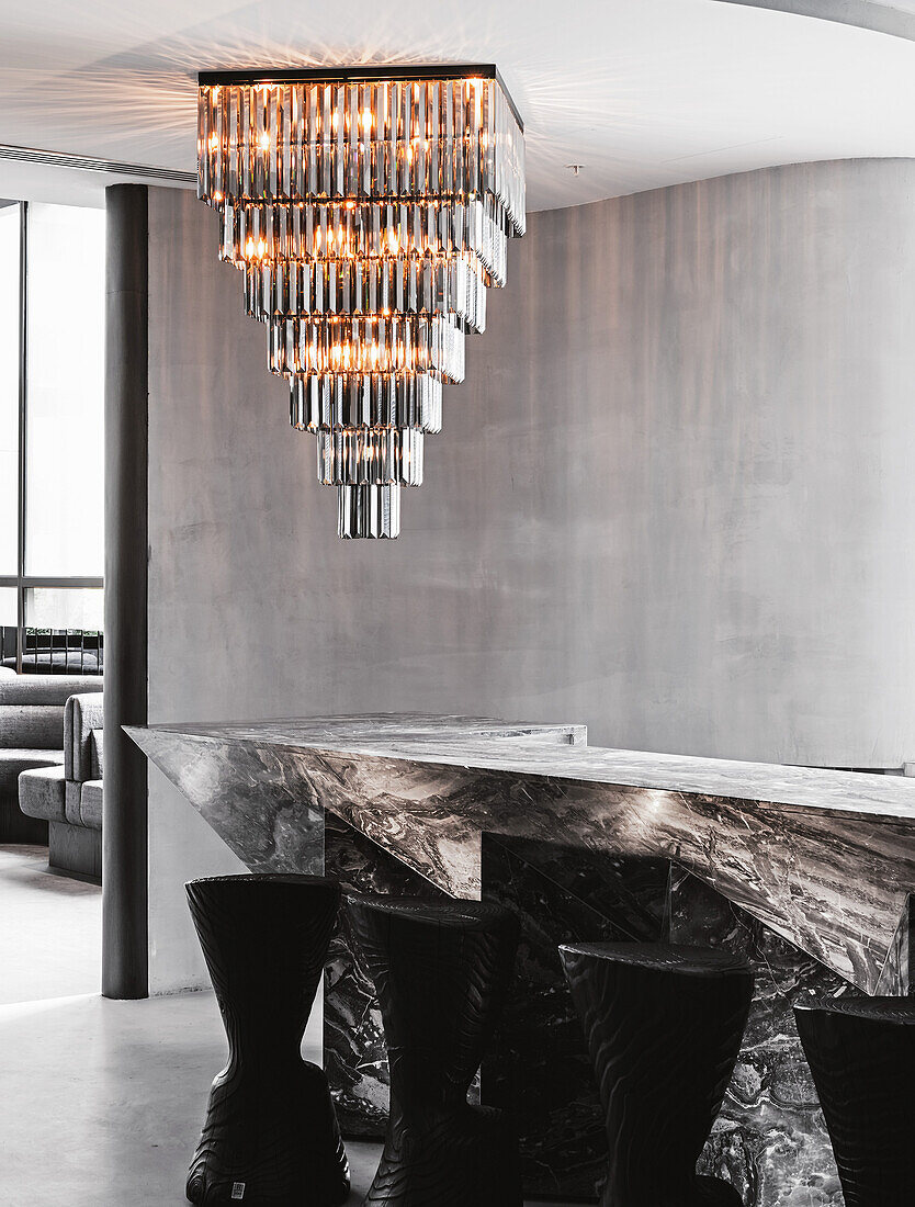 Modern chandelier above luxurious marble counter