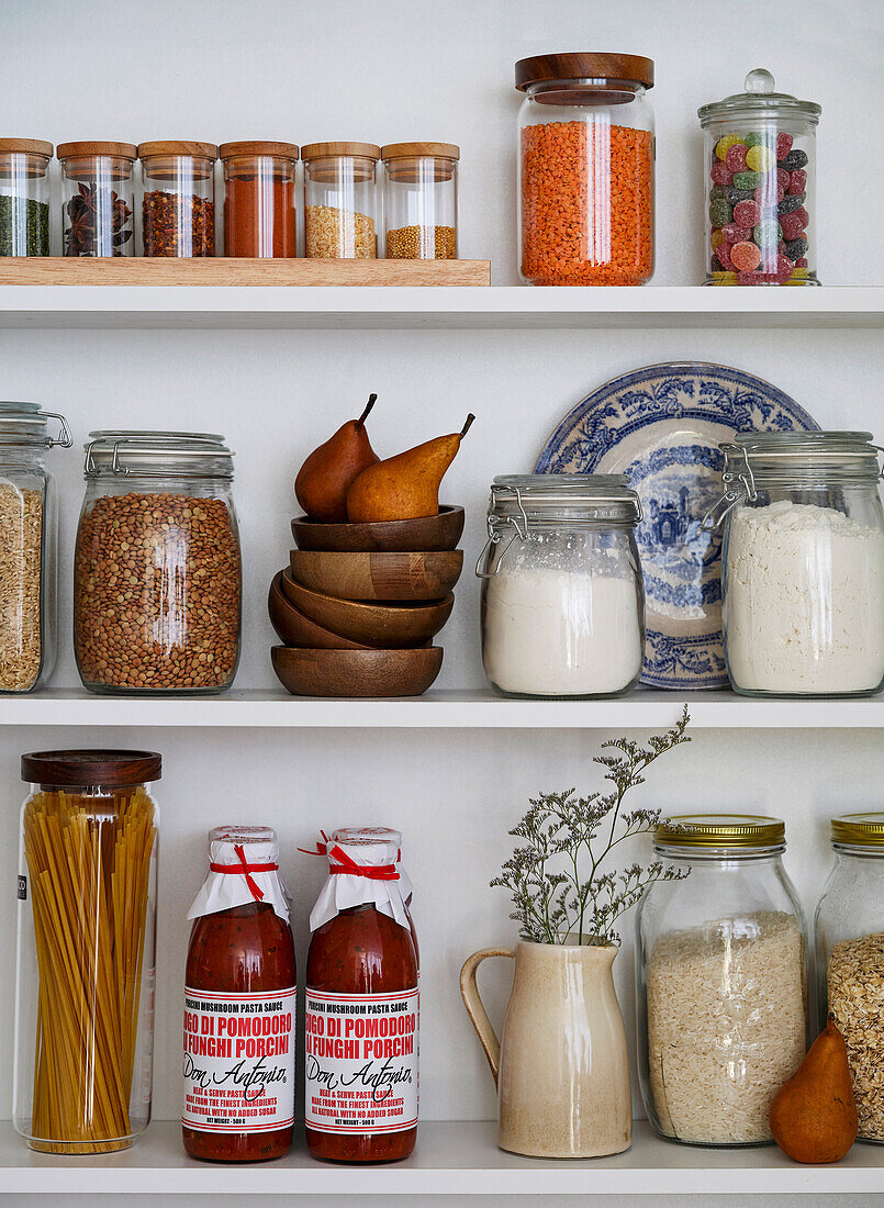 Organised storage shelf with various foods and spices