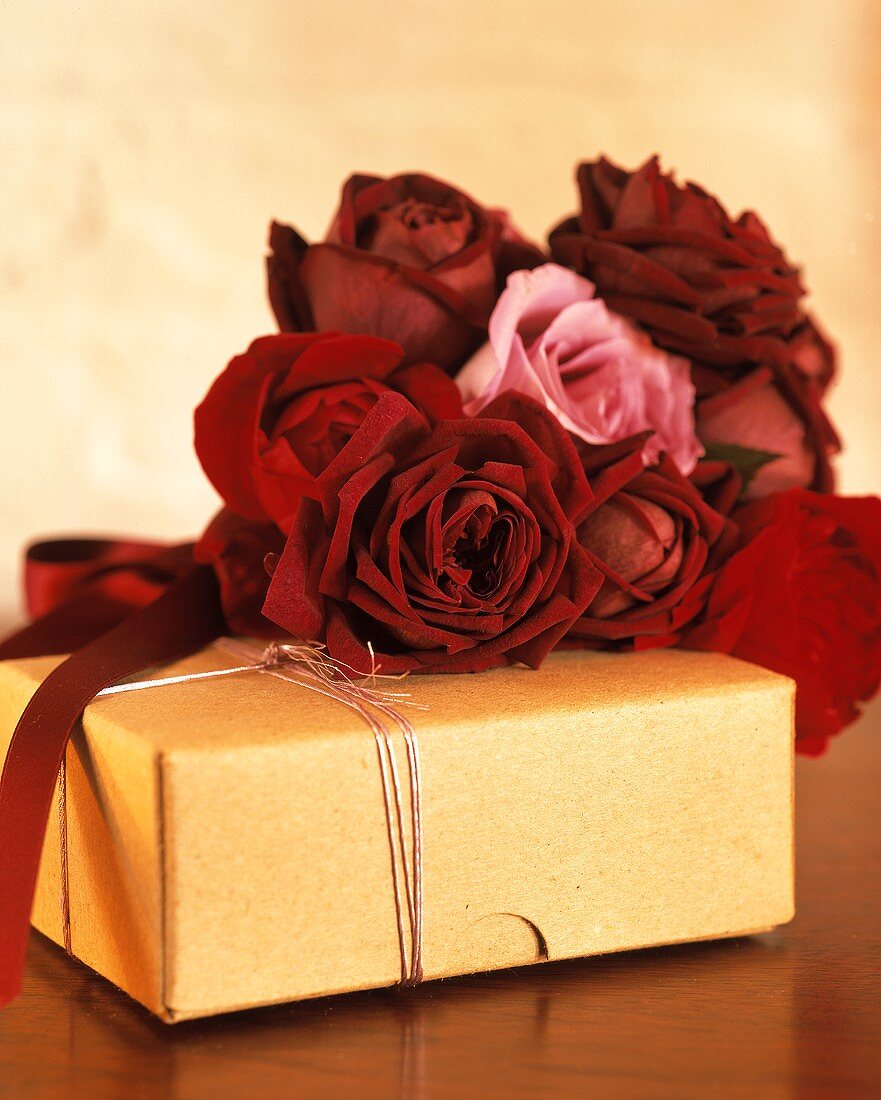 A wrapped present and red roses