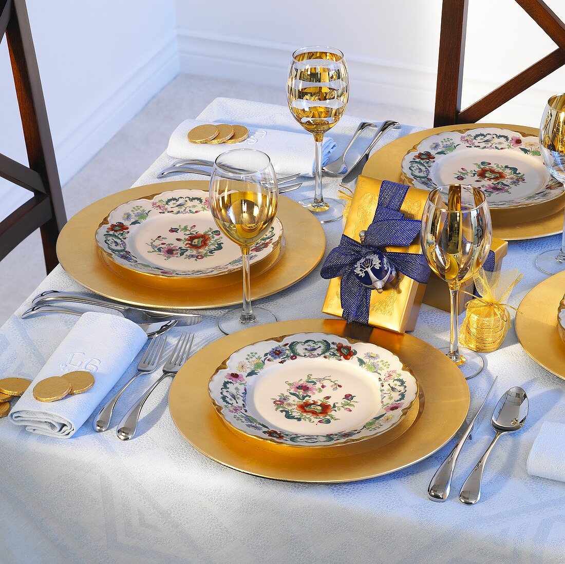 Christmas table laid in blue and gold