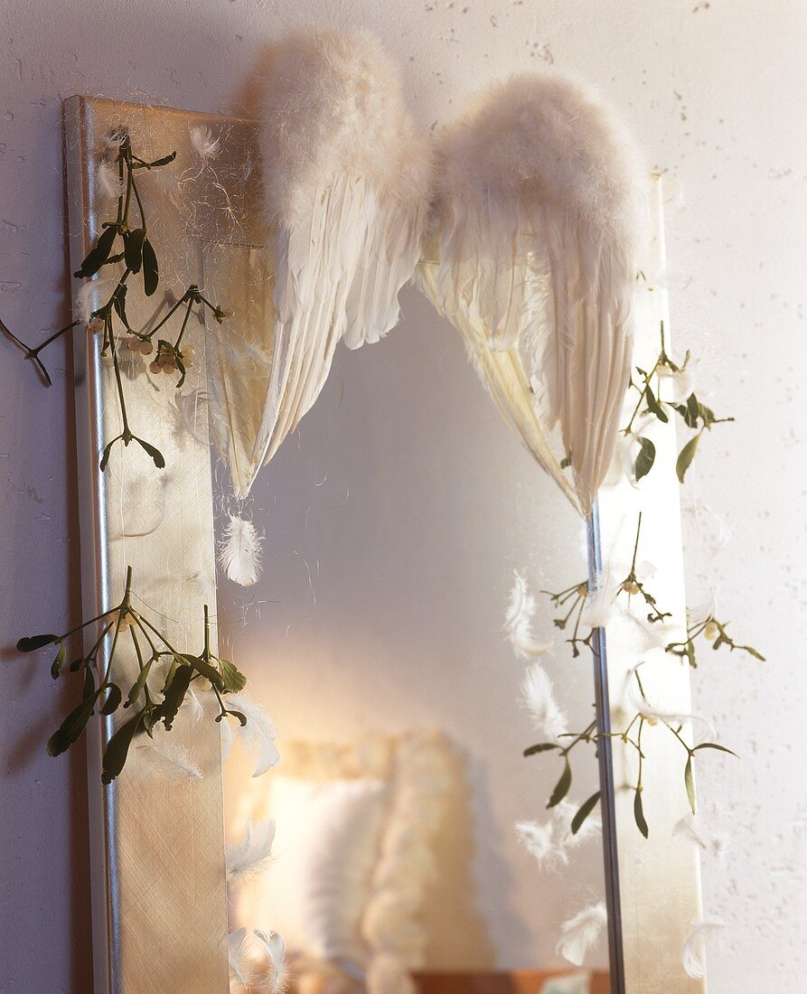 Christmas decoration: mirror trimmed with angel's wings & twigs
