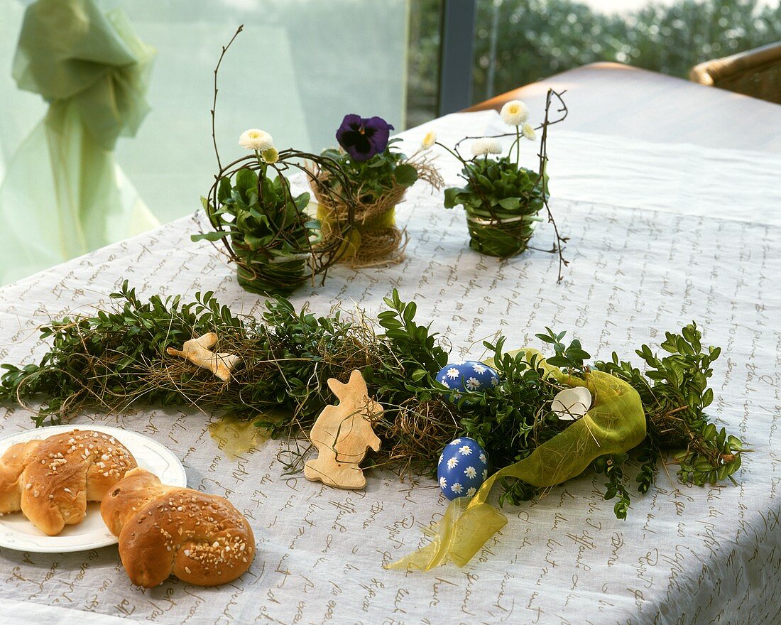Easter table decoration and yeast baking on a table