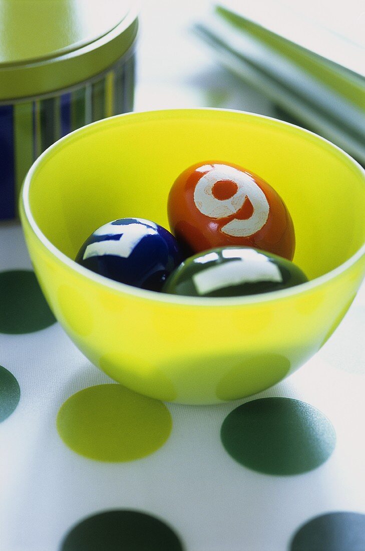 Easter eggs with numbers in a bowl