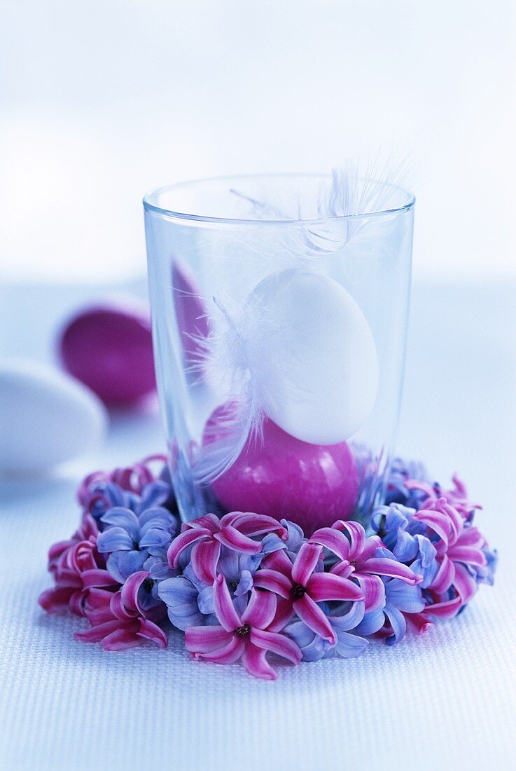 Hyacinth wreath with eggs and feathers in glass