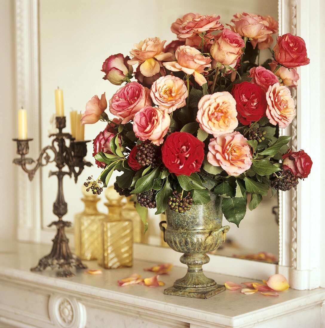 Bouquet of roses on a ledge in front of a mirror