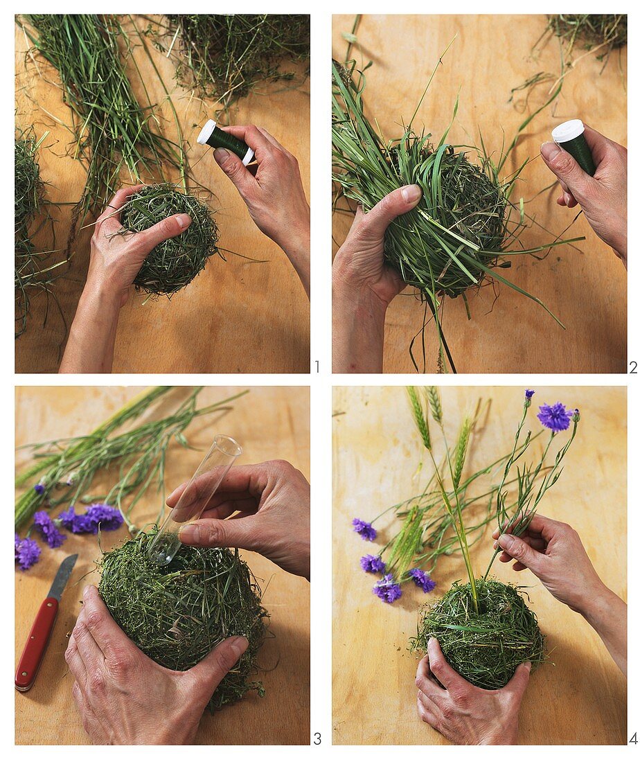 Making an arrangement of poppies and balls of moss