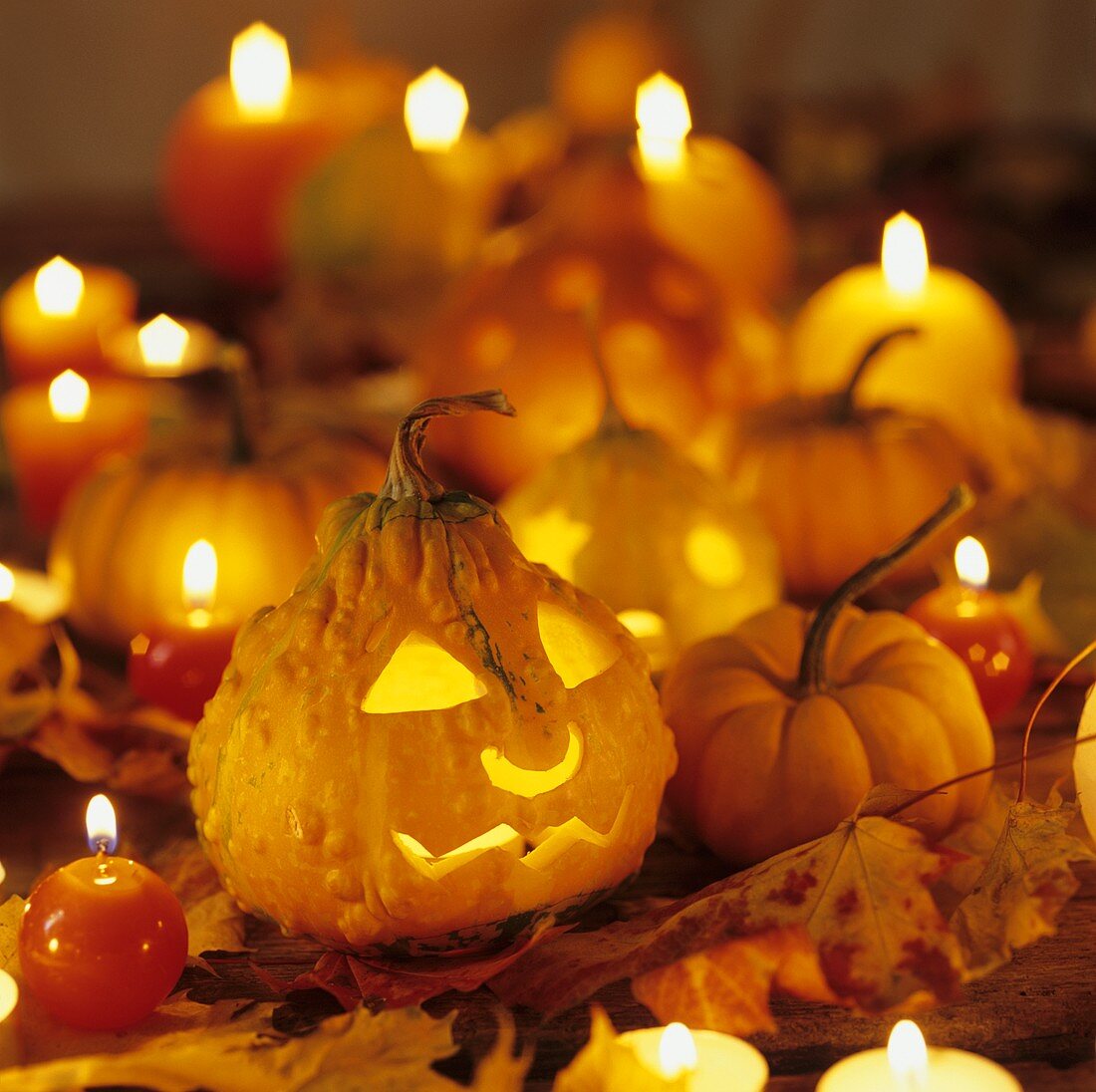 Several pumpkins and candles for Halloween