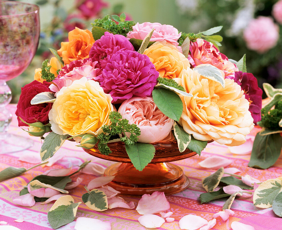 Roses, sage and parsley in a glass bowl