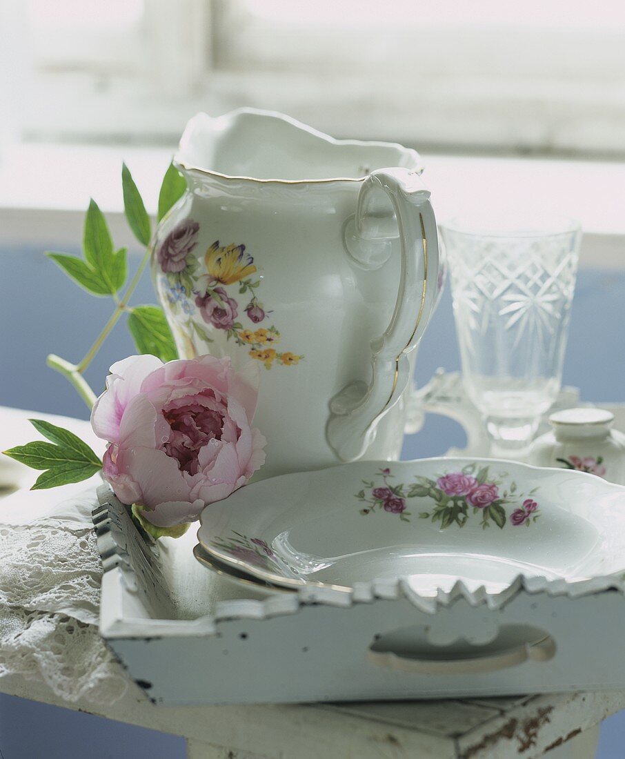 Porcelain tableware with hydrangea on a tray