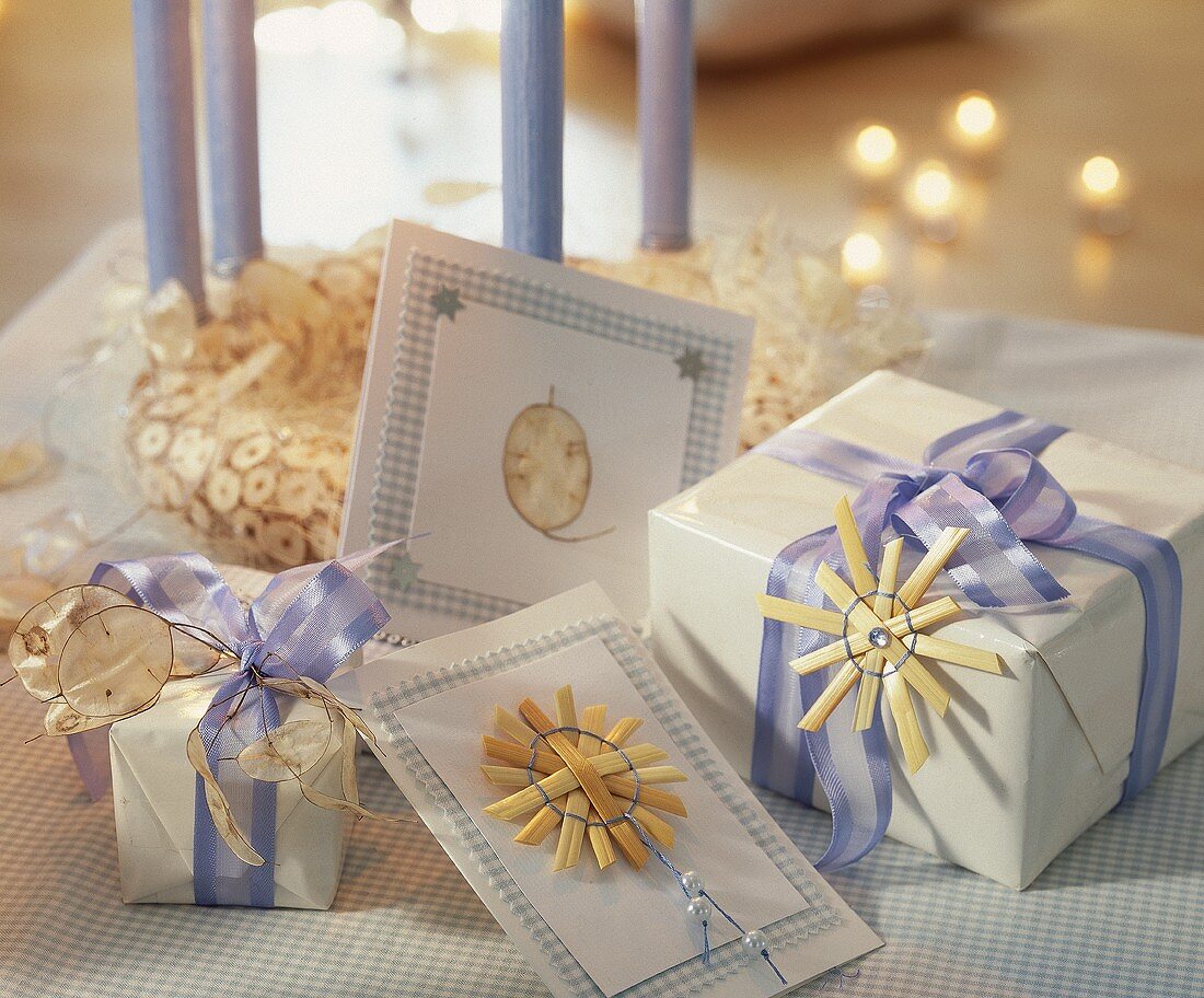 Presents and cards decorated with bows and straw stars