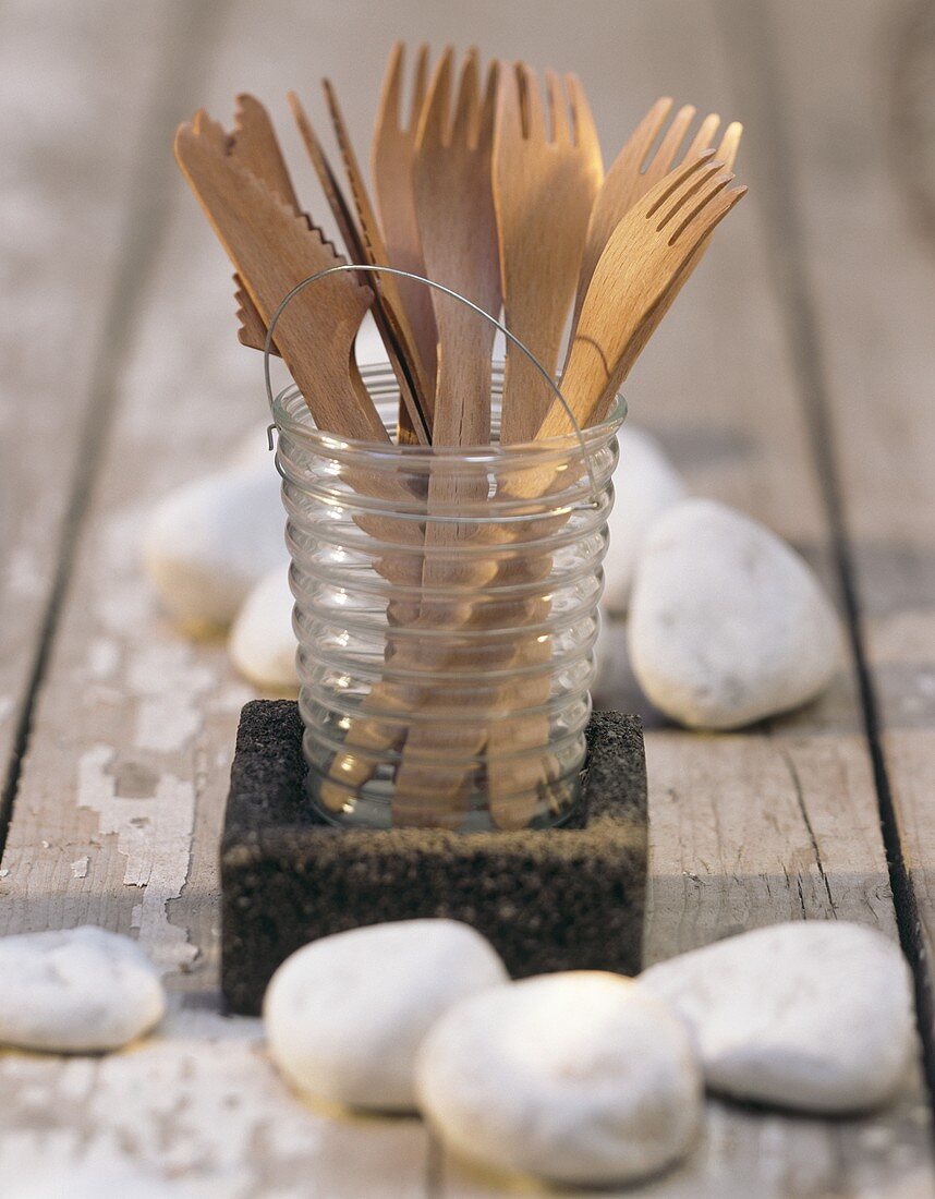 Wooden cutlery in glass for picnic