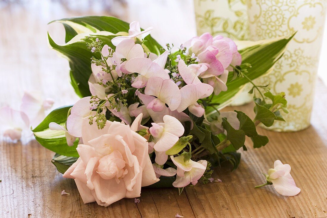 Bouquet of roses, sweet peas, thyme, hosta leaves, ivy