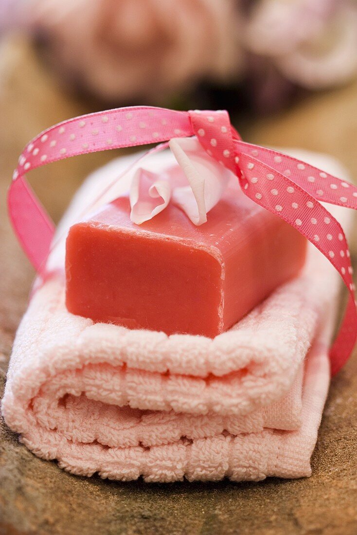 Rose soap on pink hand towel to give as a gift