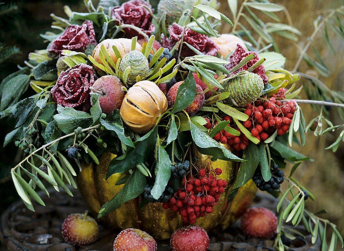 Arrangement of roses, rowan berries and fruit