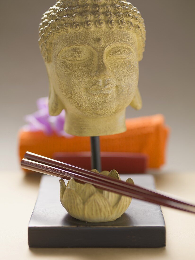 Buddha head and chopsticks