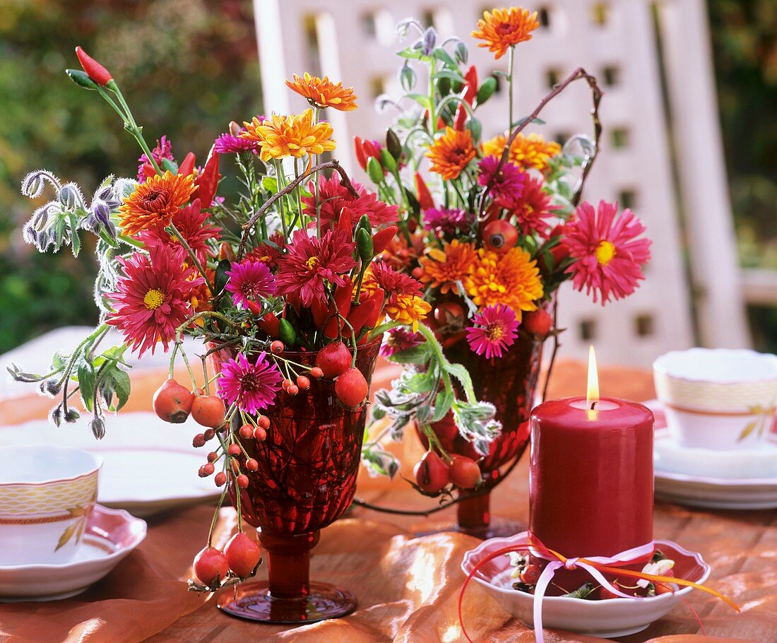 Table decoration: Chrysanthemums, Michaelmas daisy, rose hip, borage