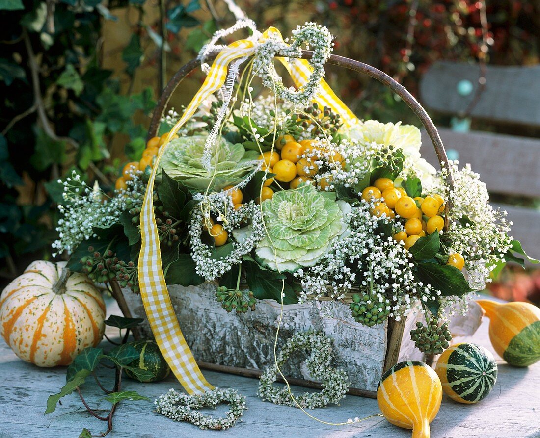 Basket with ornamental cabbage, gourds & peppers and Gypsophila