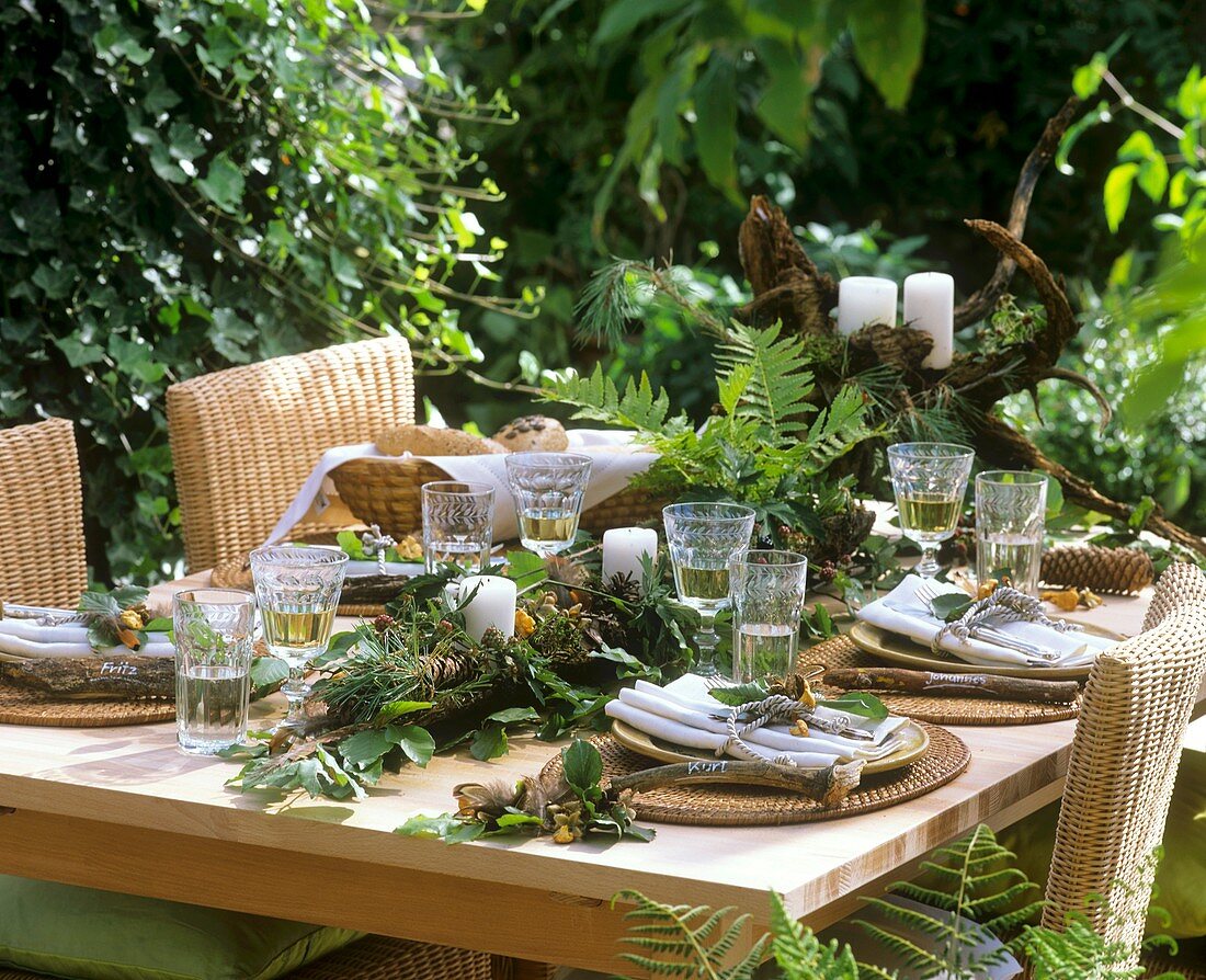 Laid table with woodland decoration