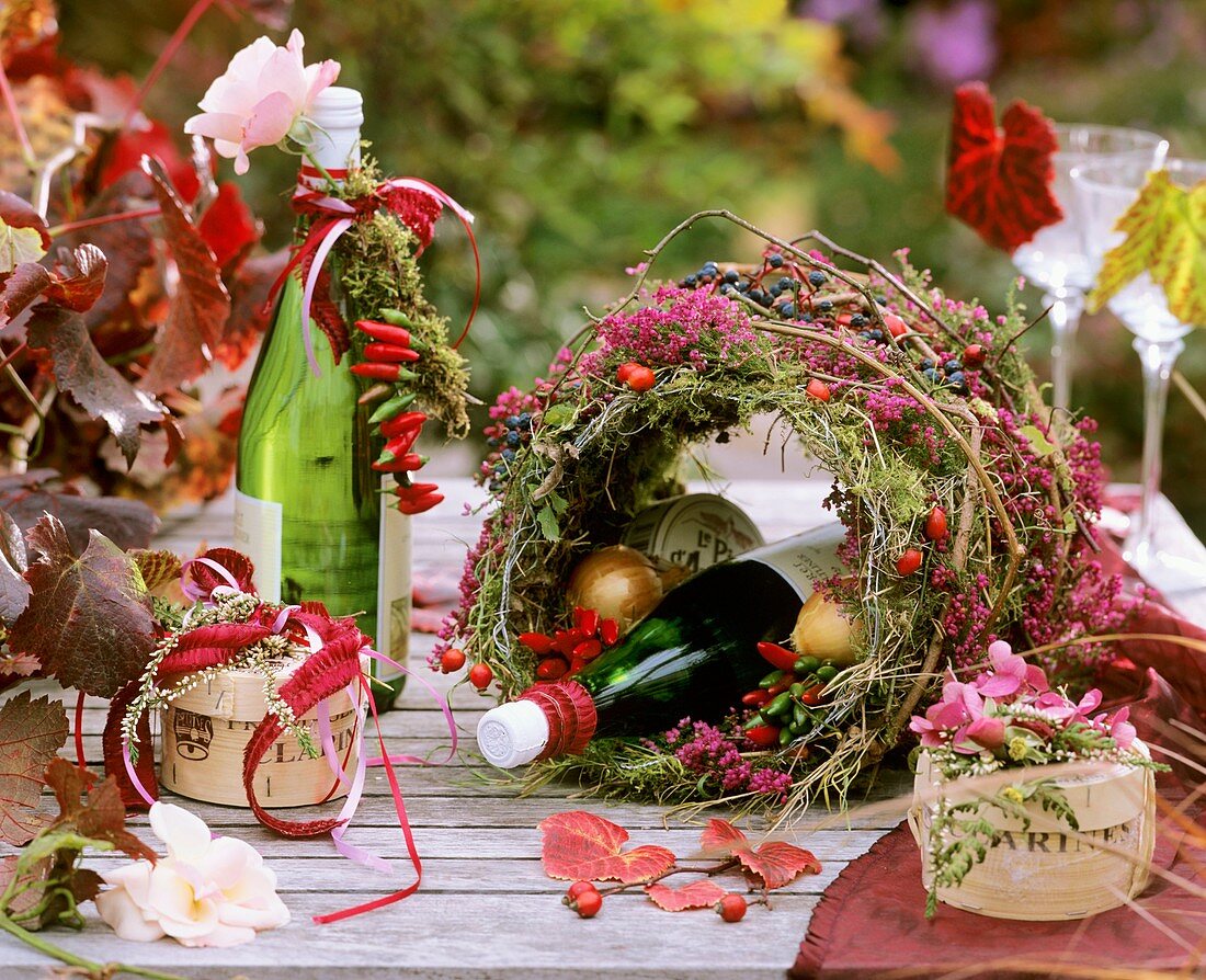 Autumn table decoration: moss, Erica and ornamental peppers