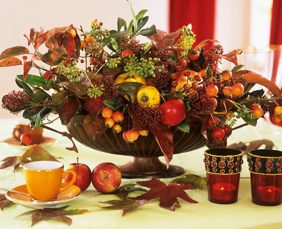 Autumnal arrangement of apples, ornamental apples and quinces