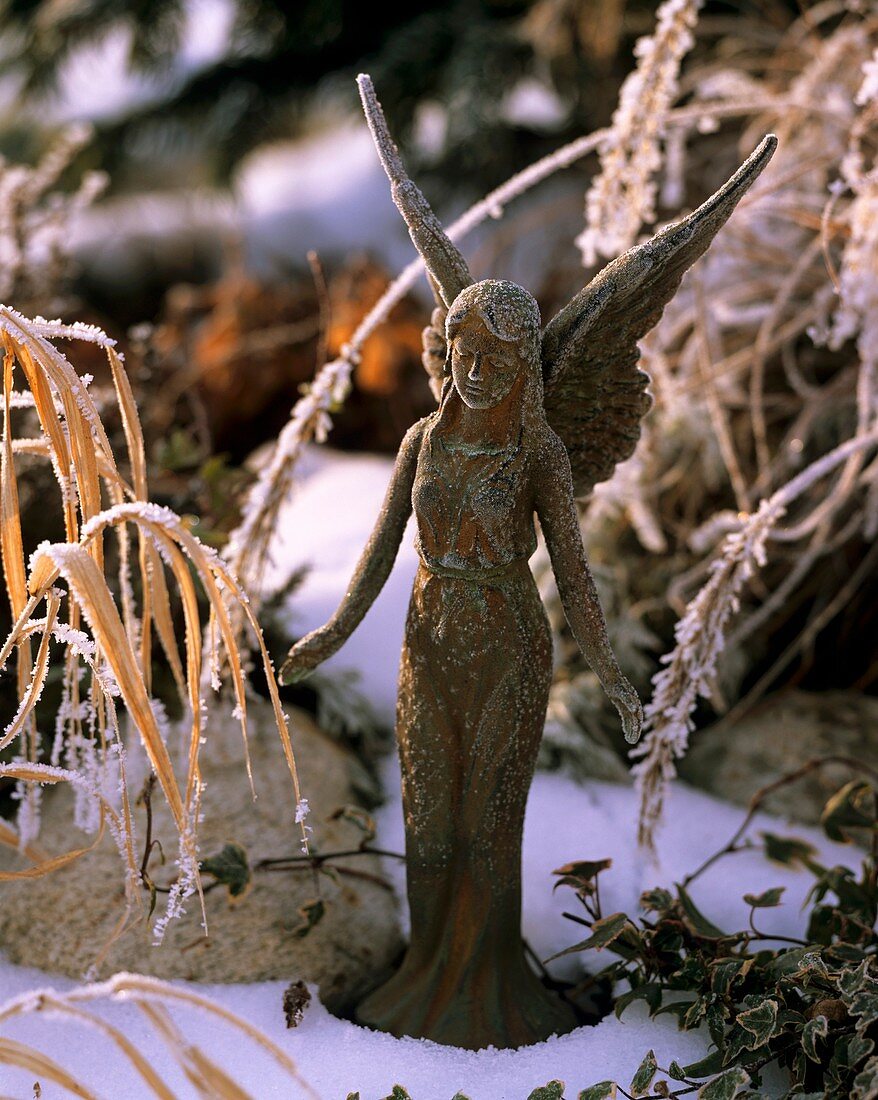 Metal angel with hoar frost