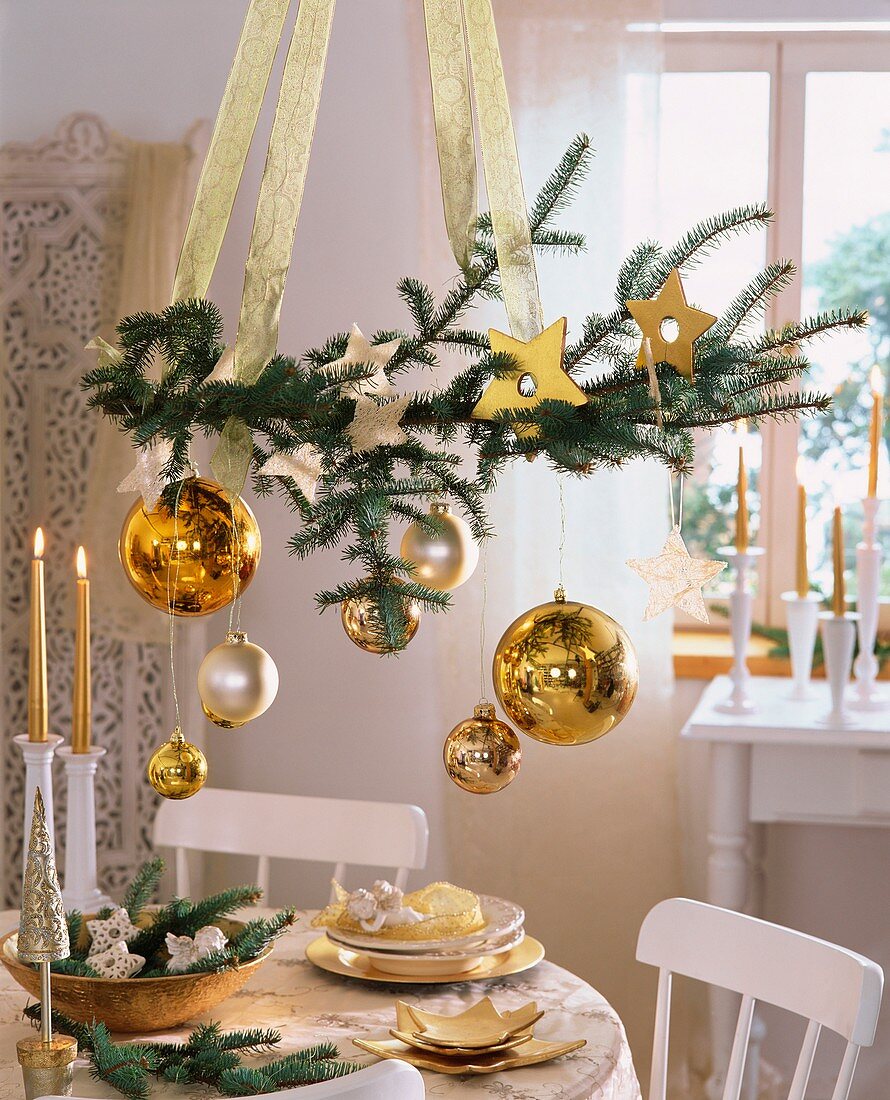 Hanging spruce branch with tree ornaments