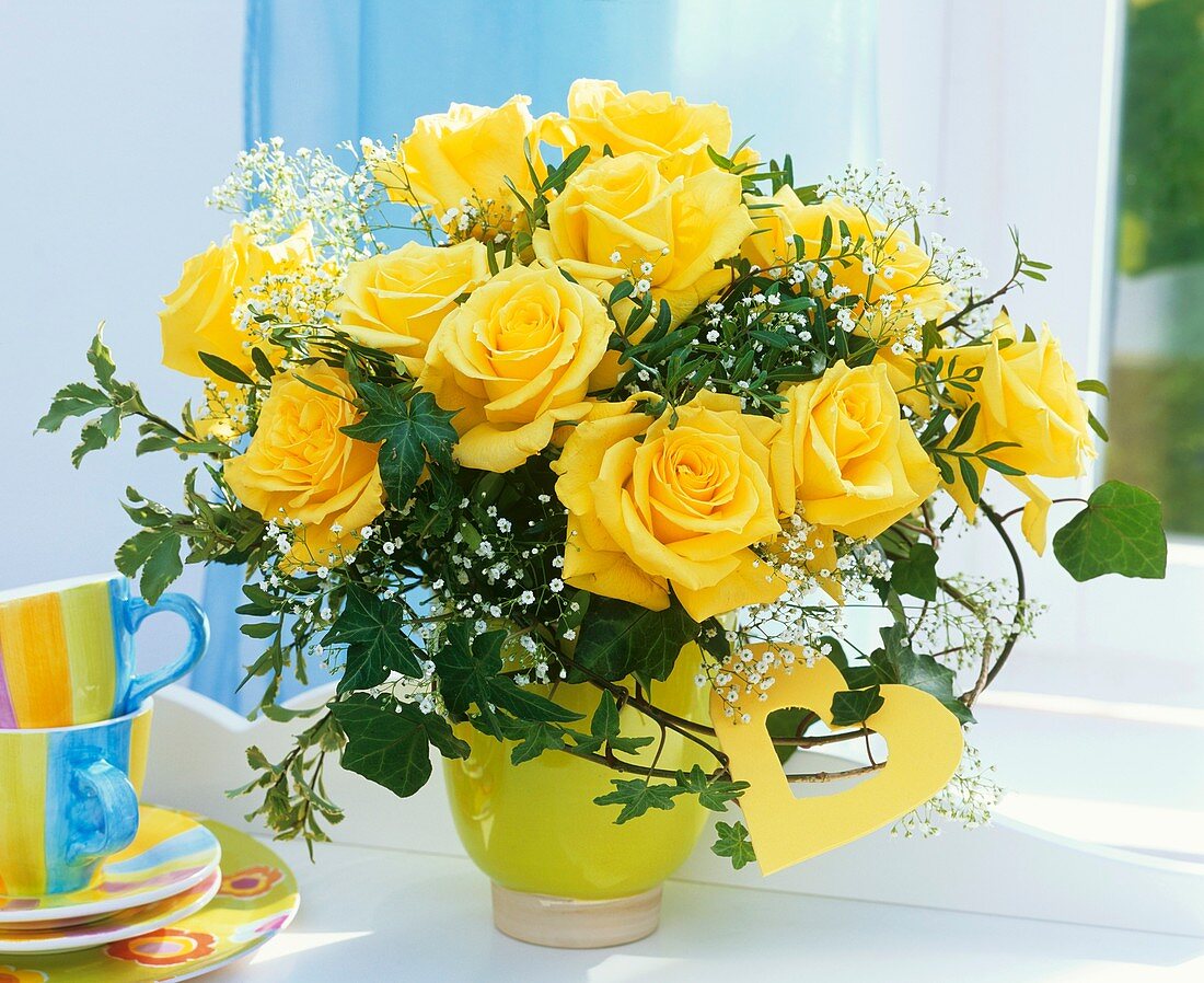 Arrangement of yellow roses and Gypsophila