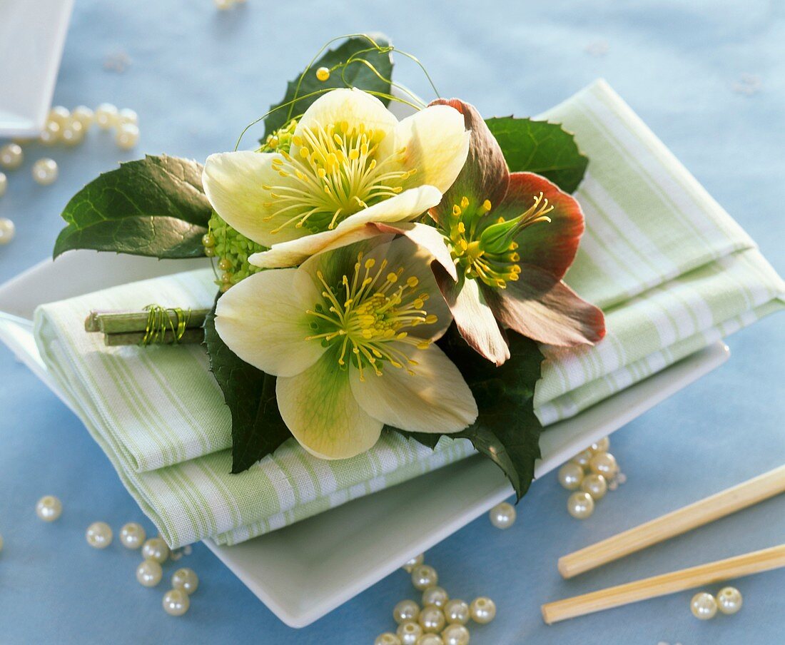 Napkin decorated with Christmas and Lenten roses