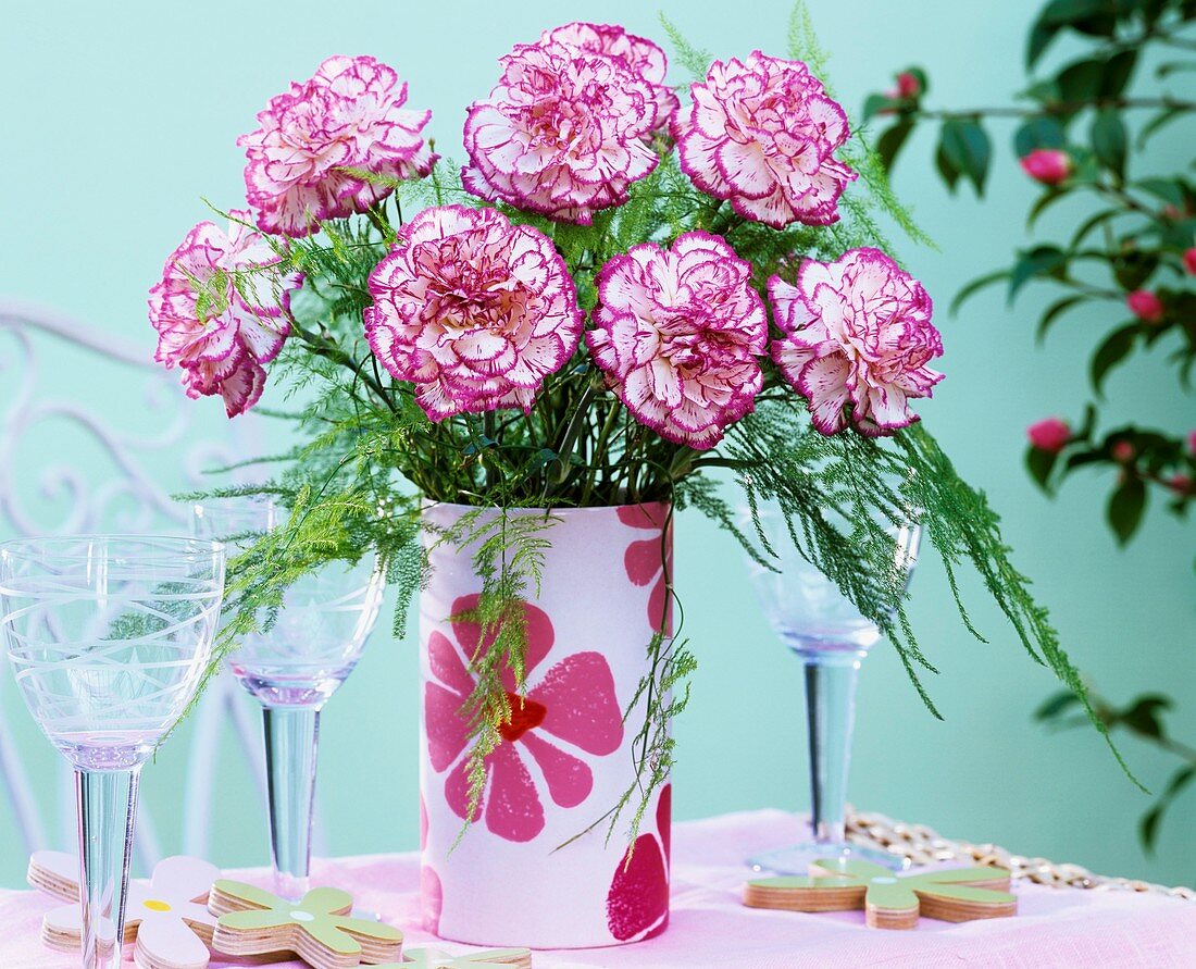 Vase of carnations with pink-edged petals