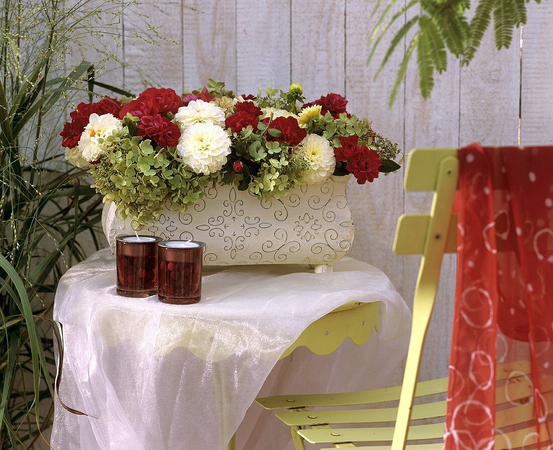 Jardiniere with roses, dahlias and hydrangeas