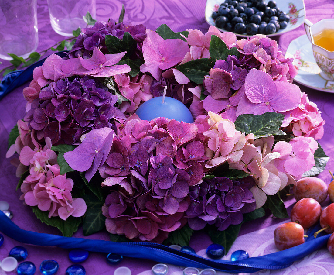 Wreath of pink hydrangeas with candle