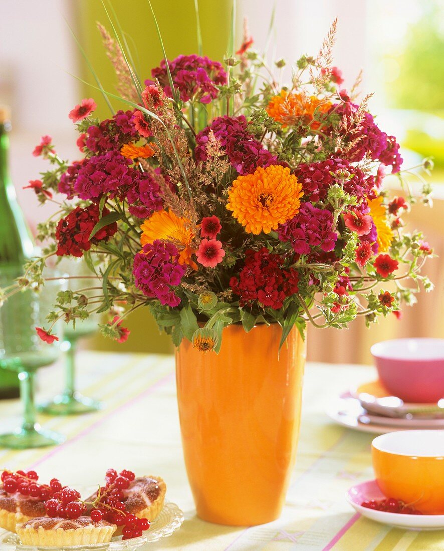 Vase of Sweet Williams, marigolds and Potentilla