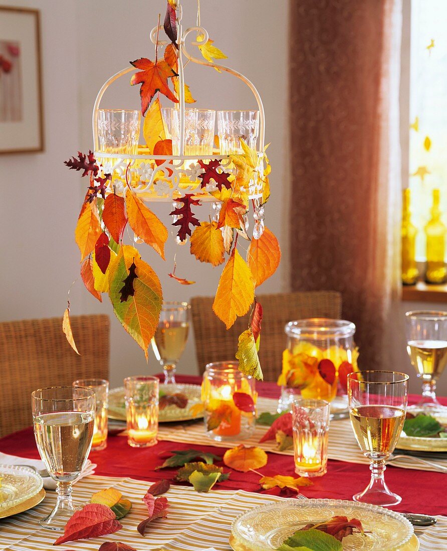 Hanging metal tray with tealights and autumn leaves