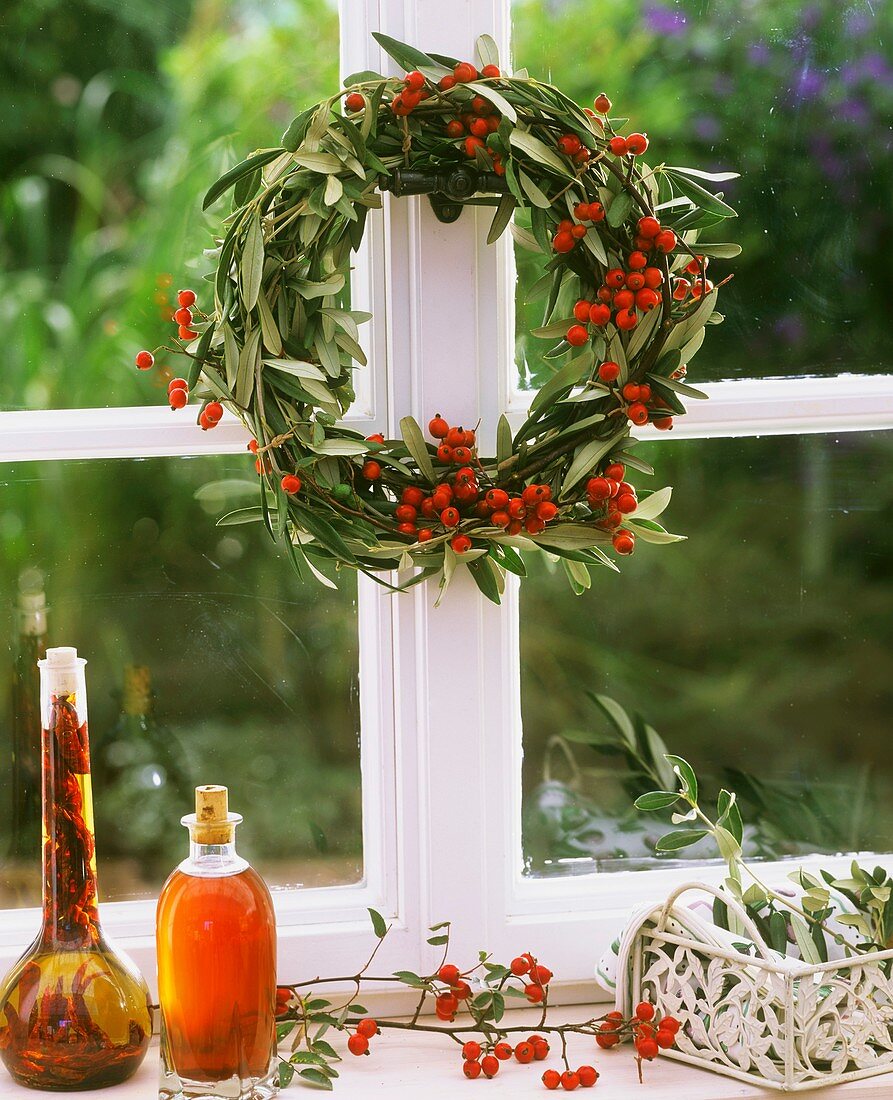 Wreath of olive branches and rose hips