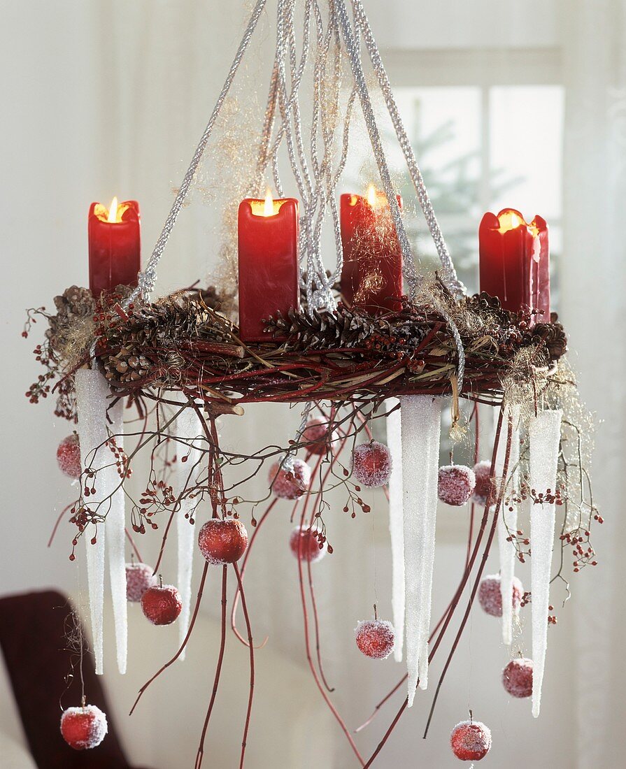Hanging Advent wreath with ornamental apples and cones