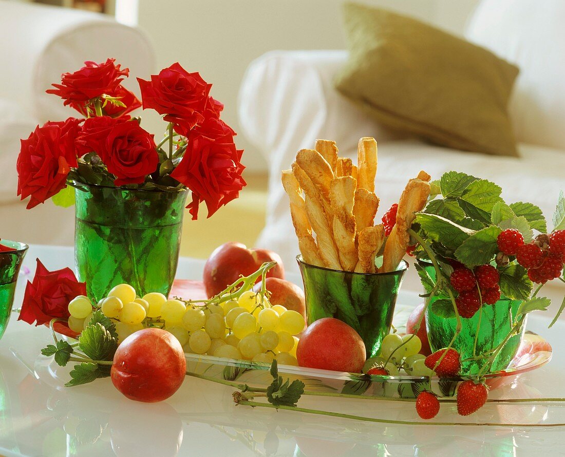 Tray with grapes, raspberries, strawberries, cheese straws