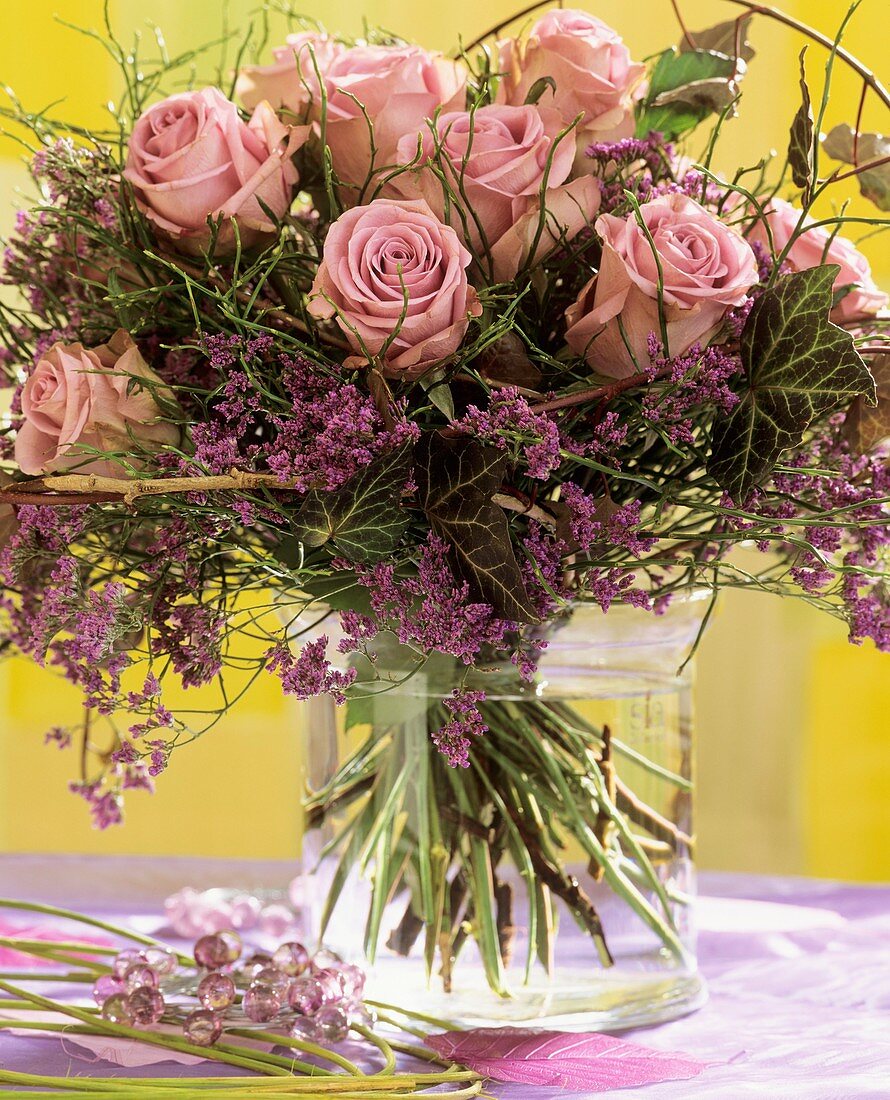 Bouquet of roses, bilberry foliage and sea lavender