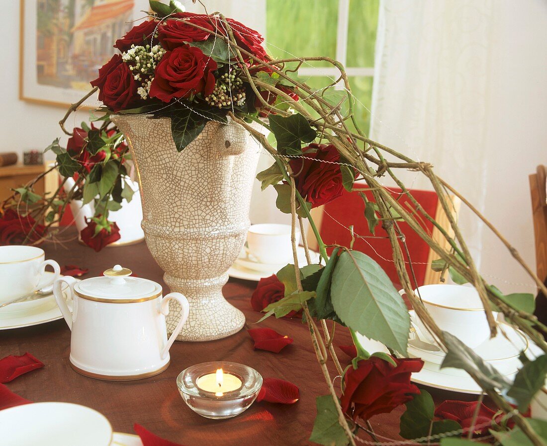 Arrangement of roses and Viburnum as table decoration