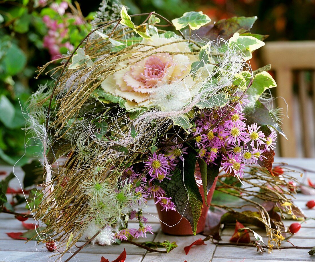 Autumn wreath of ornamental cabbage and Michaelmas daisies