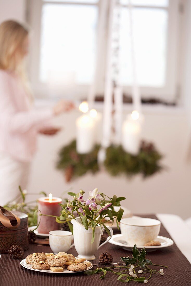 Orchids and mistletoe on laid table