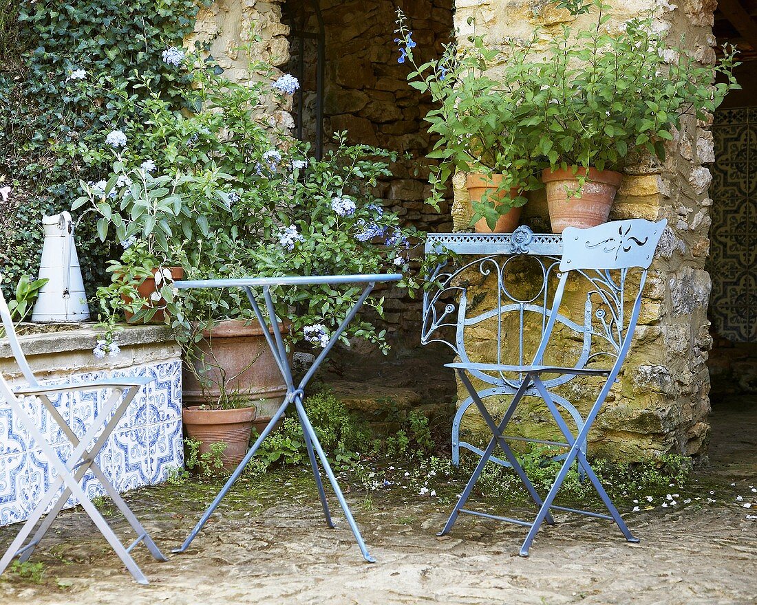 Folding chairs and table in country garden