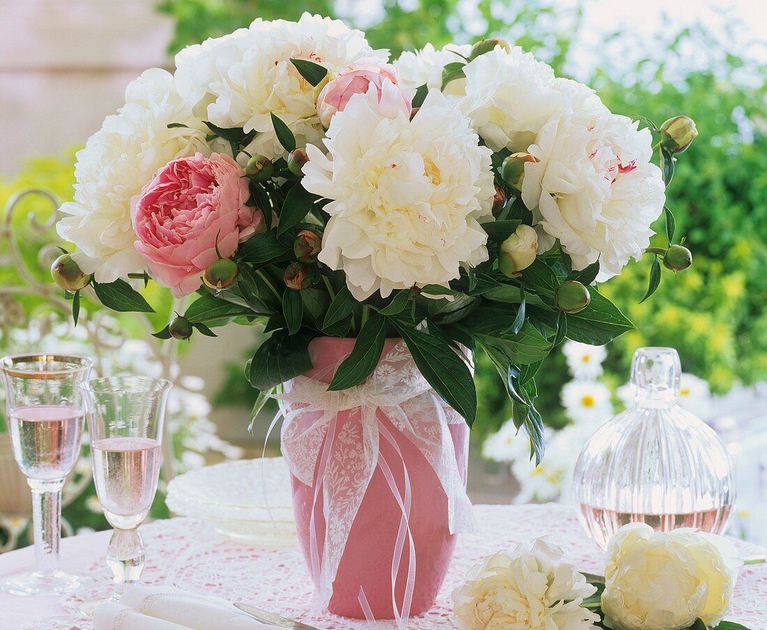 White and pink peonies in a vase
