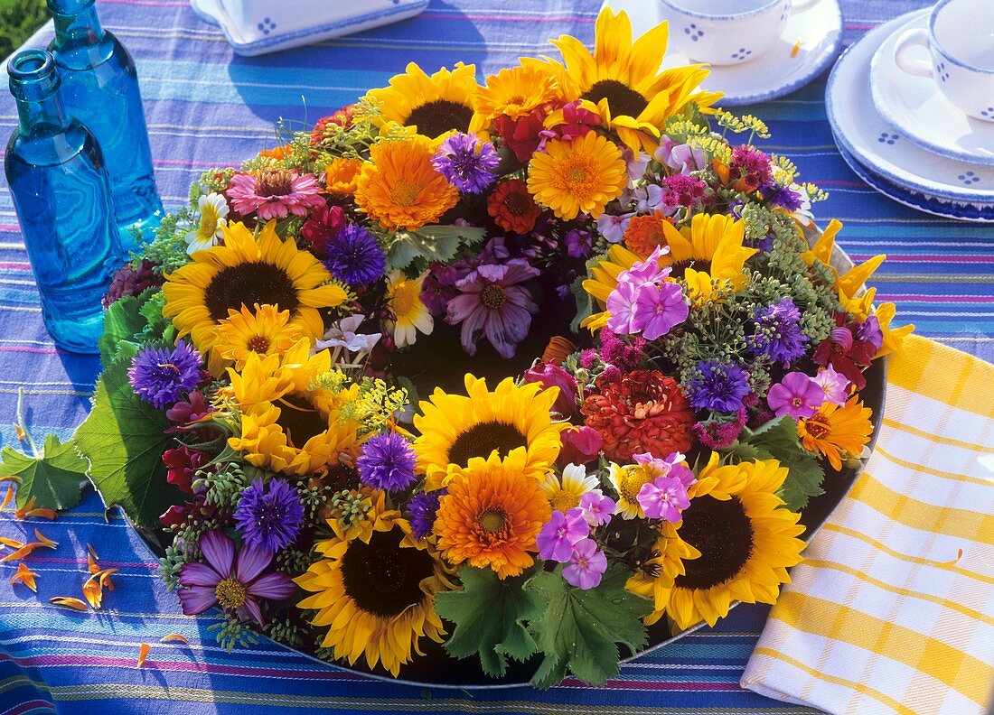 Wreath of sunflowers, marigolds, cornflowers etc.