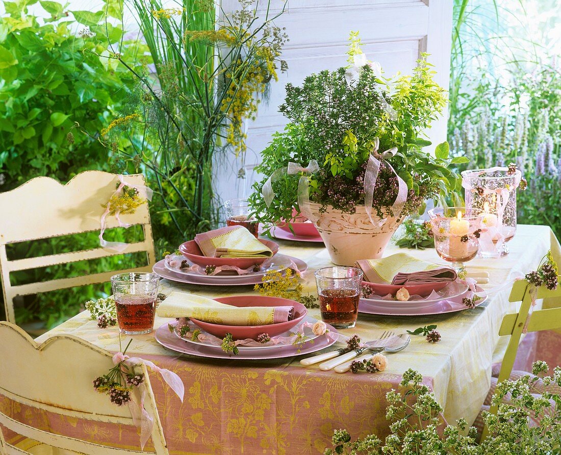 Flowering garden herbs decorating a laid table